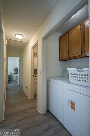 a view of hallway with wooden floor