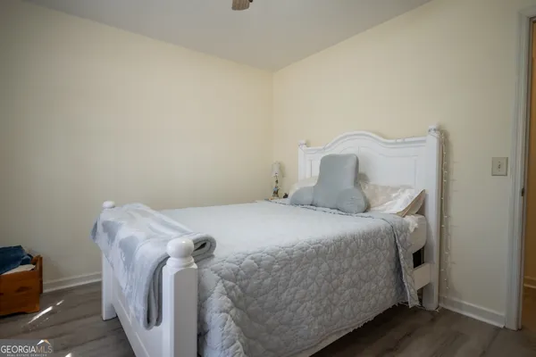 a bedroom with a bed and a couch