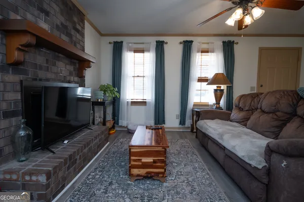 a living room with furniture and a fireplace