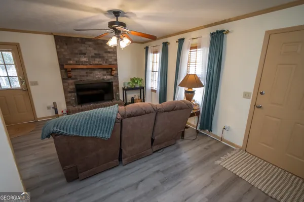 a living room with furniture and a fireplace