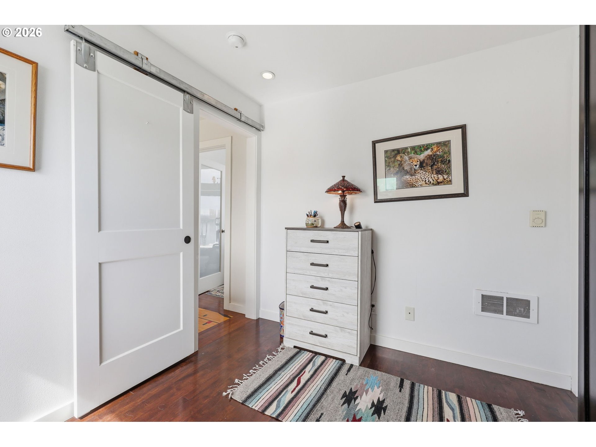 34326 Johnson's Landing Road, Unit C27 Scappoose, OR 97056 - Photo 22 of 38 a view of a bedroom with wooden floor and closet