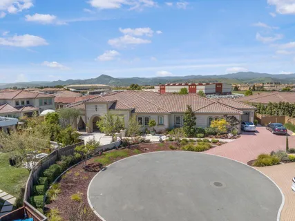 an aerial view of a house with outdoor space