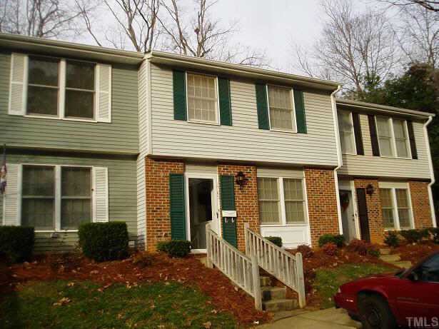 7745 Ohmann Court Raleigh, NC 27615 - Photo 1 of 1 a front view of a house with a yard