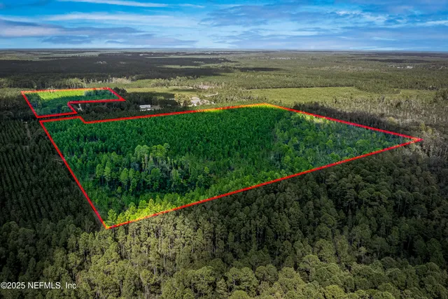 a view of swimming pool with ocean in background
