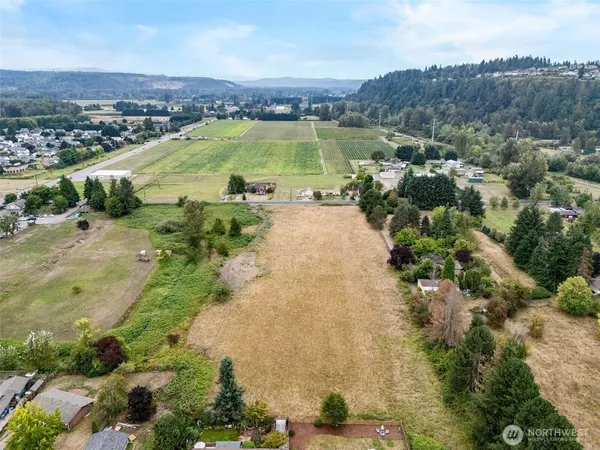 an aerial view of a residential houses and outdoor space