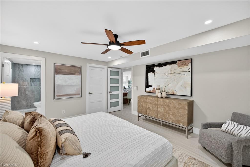 990 8th Street South, Unit 1C Naples, FL 34102 - Photo 14 of 24 a bedroom with a bed and window