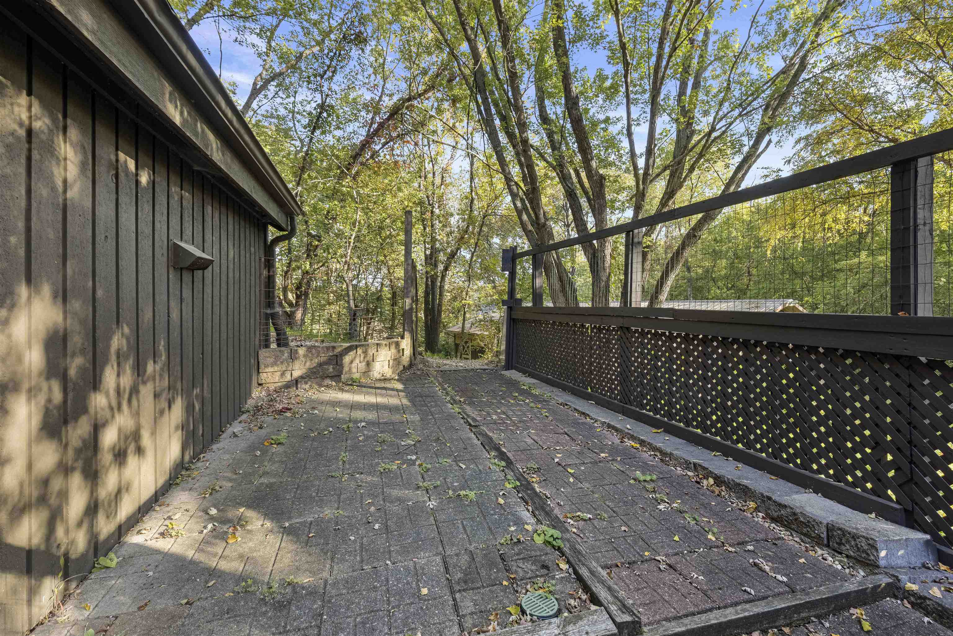 7145 South Rock Nation Road Dixon, IL 61021 - Photo 13 of 72 a view of backyard with wooden fence and large trees