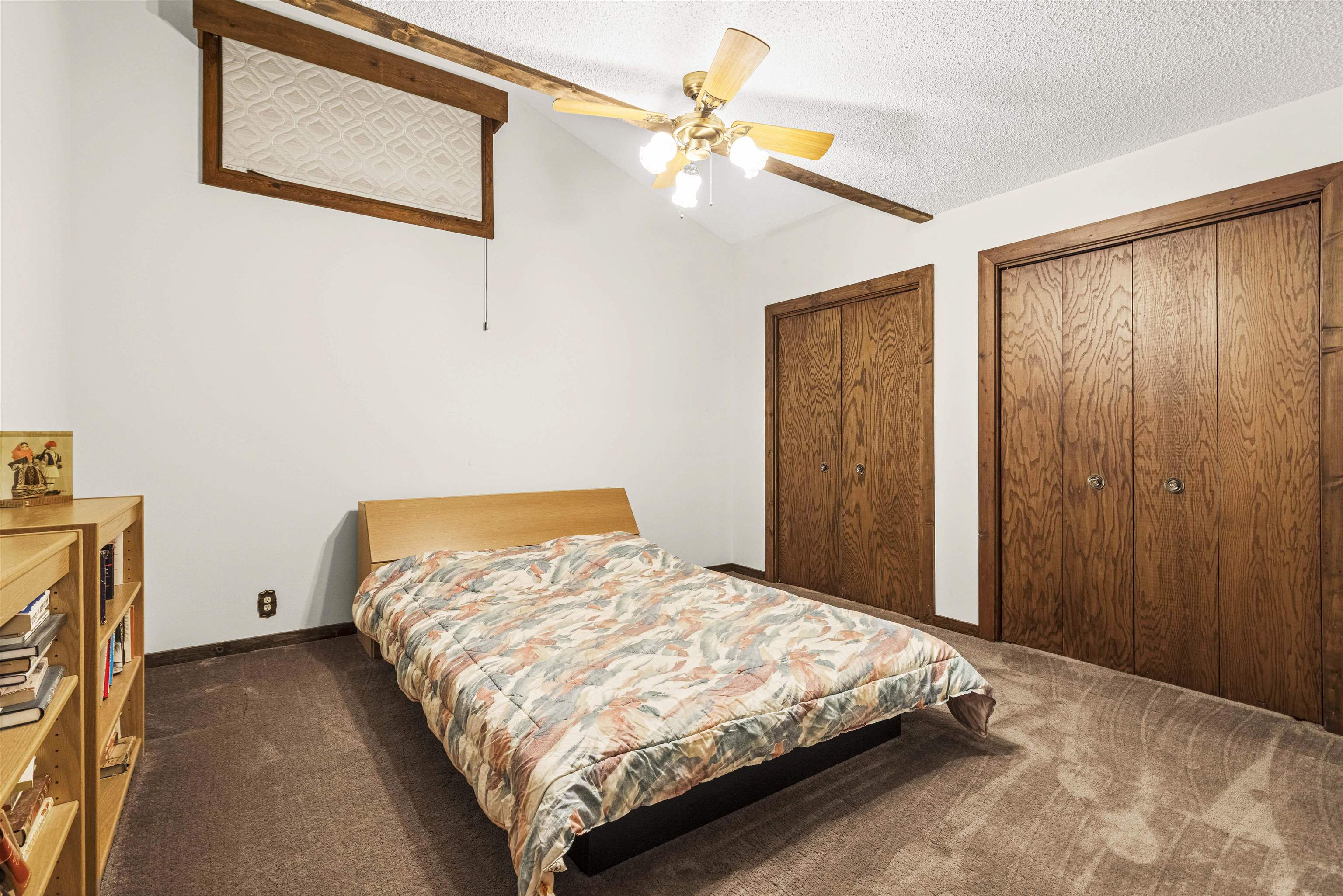 7145 South Rock Nation Road Dixon, IL 61021 - Photo 34 of 72 a bedroom with a bed and a chandelier