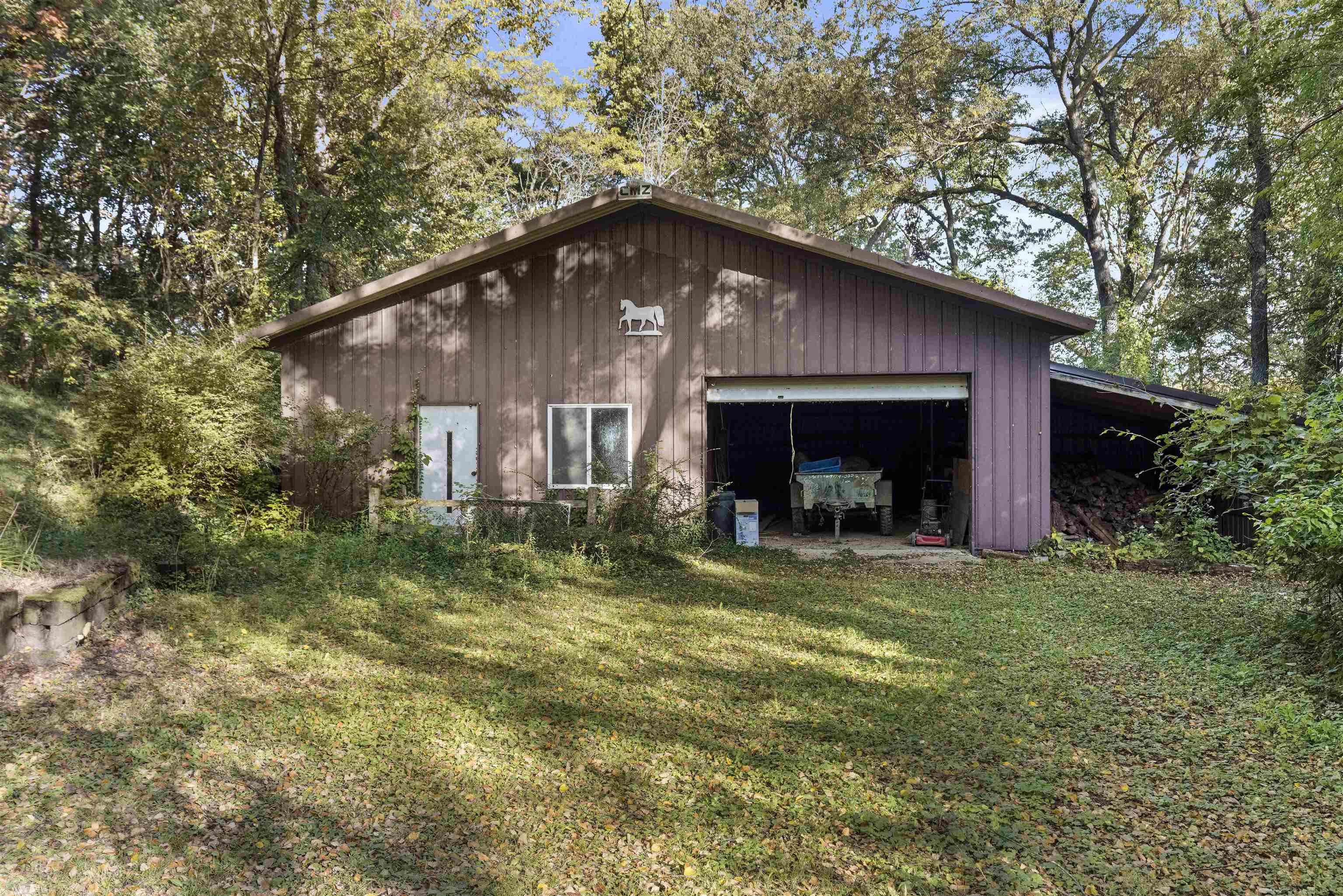 7145 South Rock Nation Road Dixon, IL 61021 - Photo 38 of 72 a view of a house with a yard and large tree