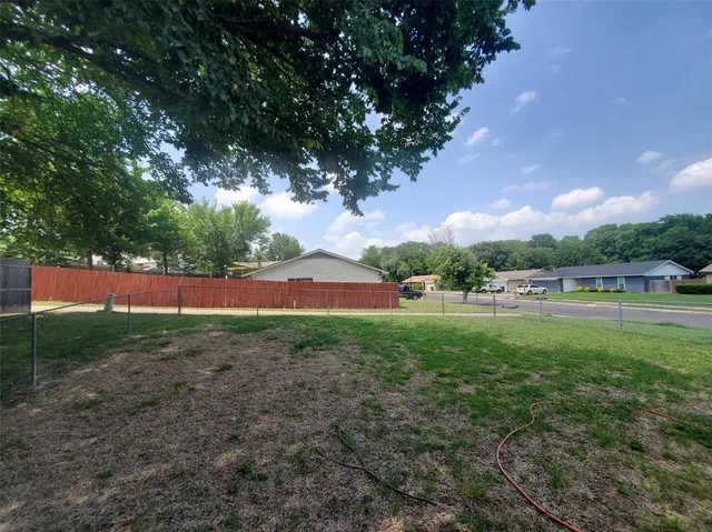 a view of outdoor space with deck and yard
