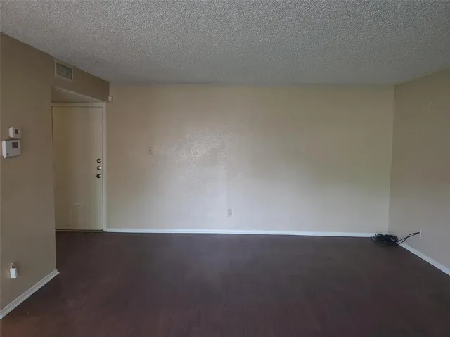 an empty room with a bench