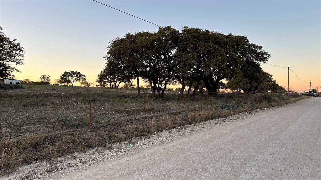 277 County Road 505 Goldthwaite, TX 76844 - Photo 4 of 14 a view of dirt road with a building in the background