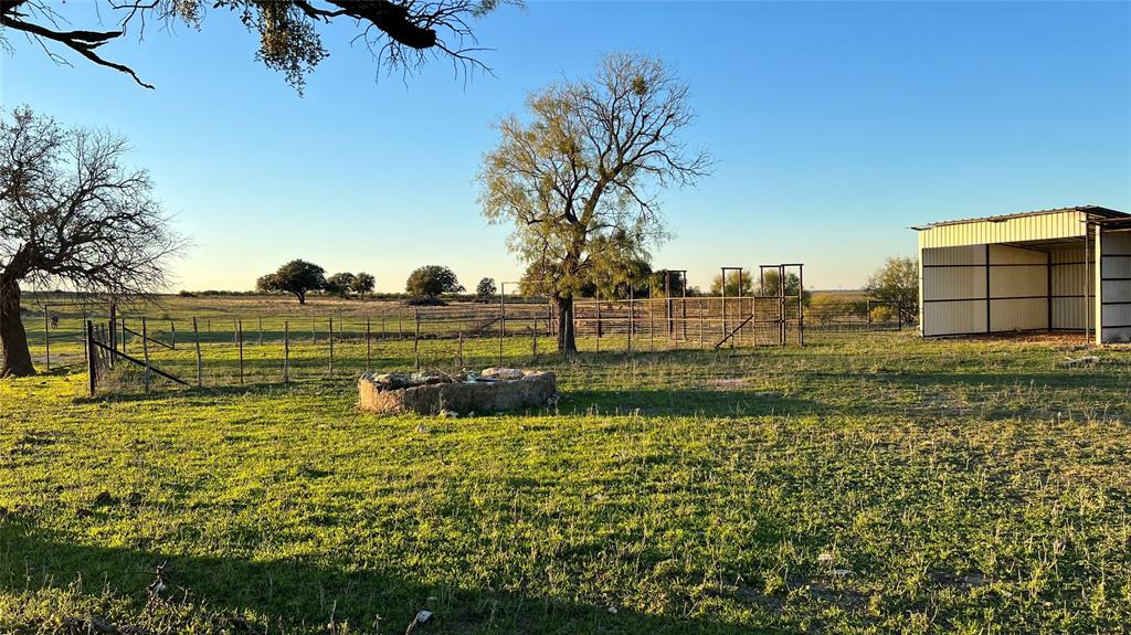 277 County Road 505 Goldthwaite, TX 76844 - Photo 8 of 14 a view of a lake with a building in the background