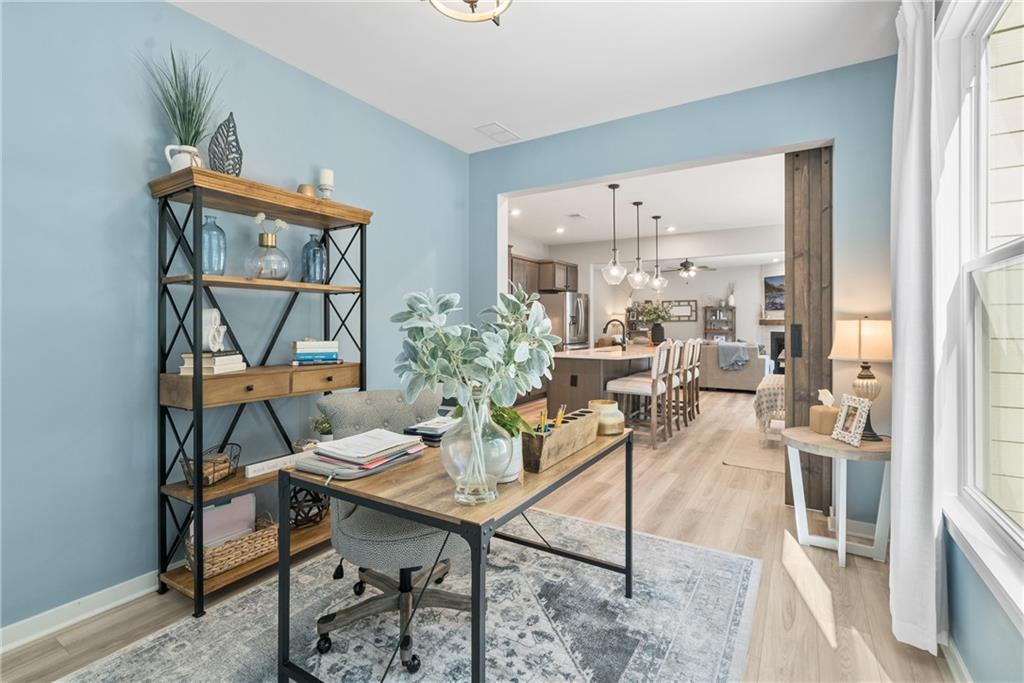8530 Scenic Ridge Way Ball Ground, GA 30107 - Photo 14 of 45 a view of a dining room with furniture window and wooden floor