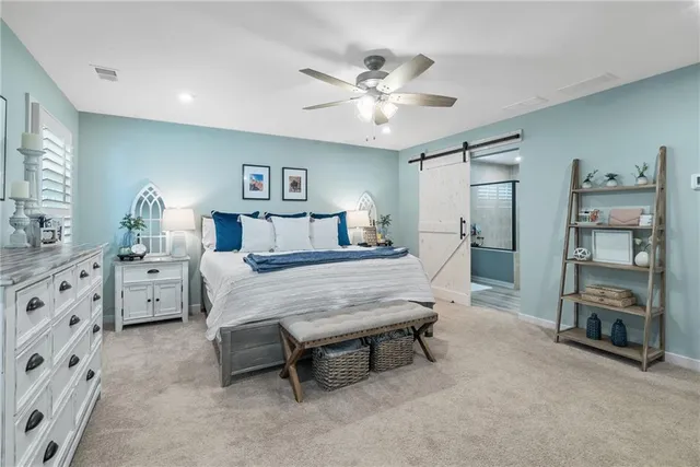 a bedroom with furniture and a chandelier