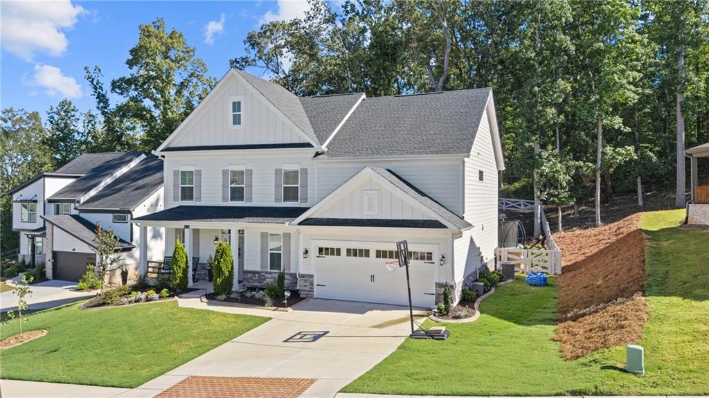 8530 Scenic Ridge Way Ball Ground, GA 30107 - Photo 2 of 45 a view of house with garden