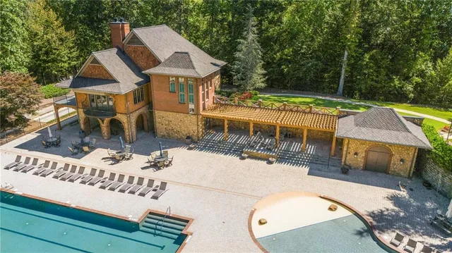 a view of a swimming pool with a patio