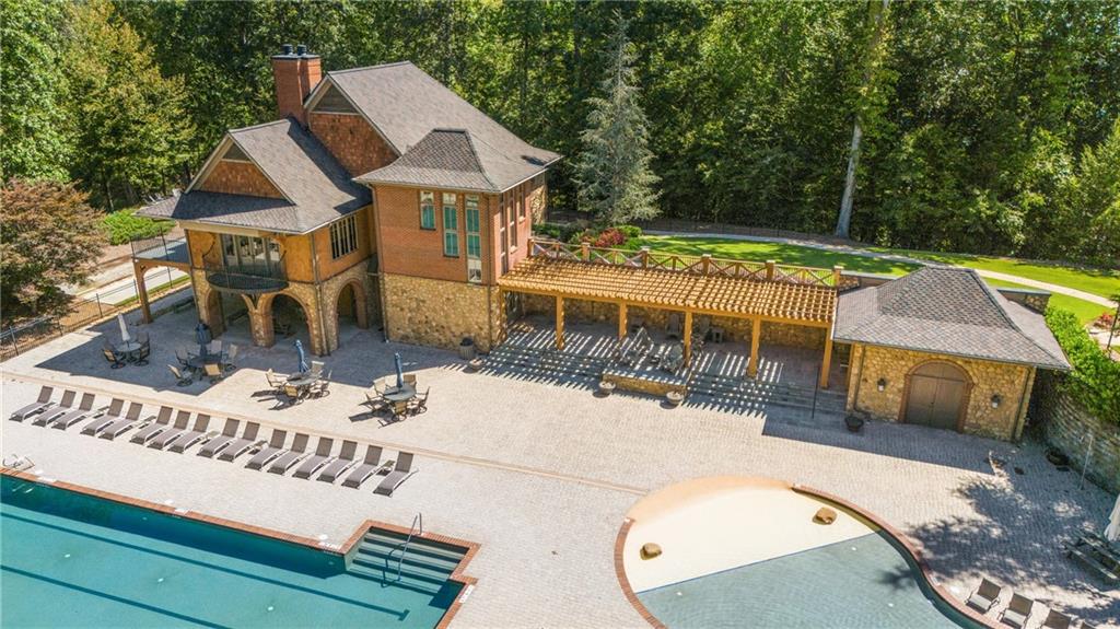 8530 Scenic Ridge Way Ball Ground, GA 30107 - Photo 40 of 45 a view of a swimming pool with a patio