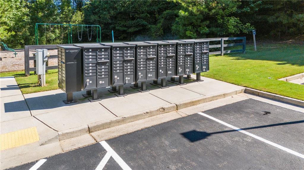 8530 Scenic Ridge Way Ball Ground, GA 30107 - Photo 44 of 45 a view of a swimming pool with a patio and a garden