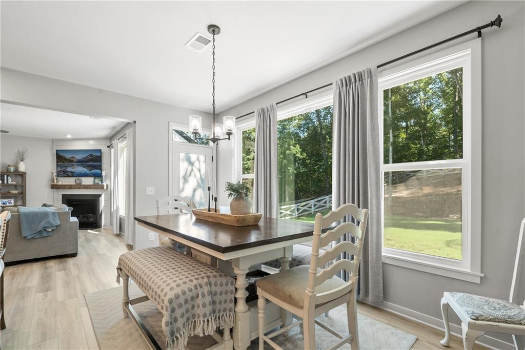 8530 Scenic Ridge Way Ball Ground, GA 30107 - Photo 8 of 45 a living room with furniture and a window