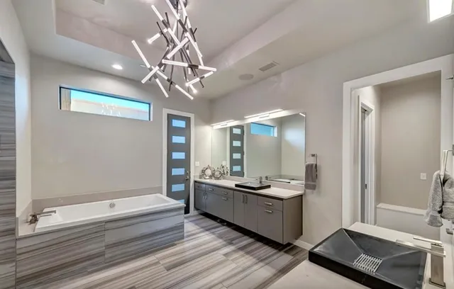 a bedroom with furniture and a flat screen tv