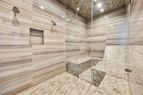 a bathroom with a shower and a sink