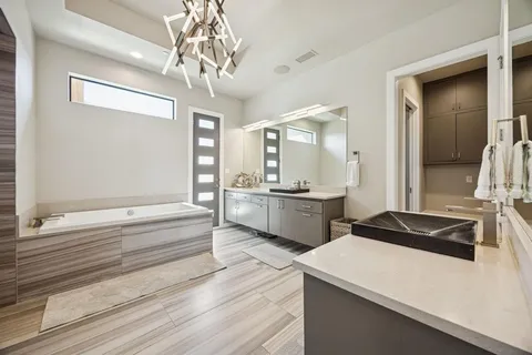 a bathroom with a shower and a sink