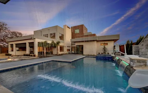 a front view of a house with swimming pool