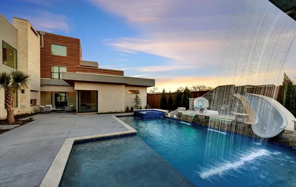 a front view of a house with swimming pool