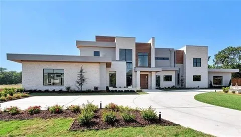 a front view of a house with swimming pool