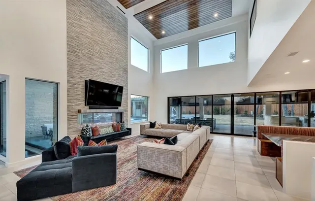 a living room with furniture fireplace and a flat screen tv