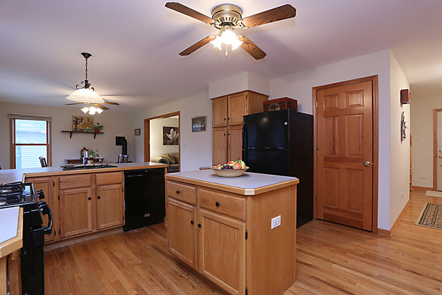 654 Ridge Drive Elburn, IL 60119 - Photo 12 of 25 a kitchen with a chandelier