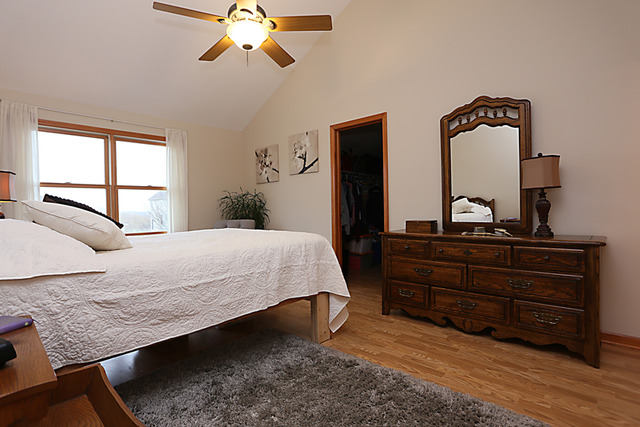 654 Ridge Drive Elburn, IL 60119 - Photo 13 of 25 a bedroom with a bed and dresser with window