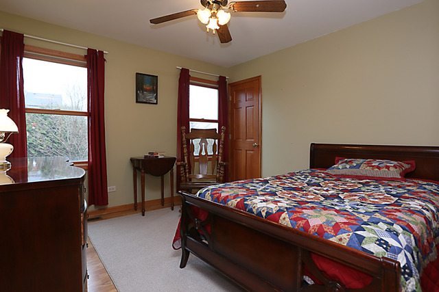 654 Ridge Drive Elburn, IL 60119 - Photo 15 of 25 a bedroom with a bed and a window