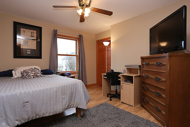 654 Ridge Drive Elburn, IL 60119 - Photo 17 of 25 a bedroom with a bed and a flat screen tv
