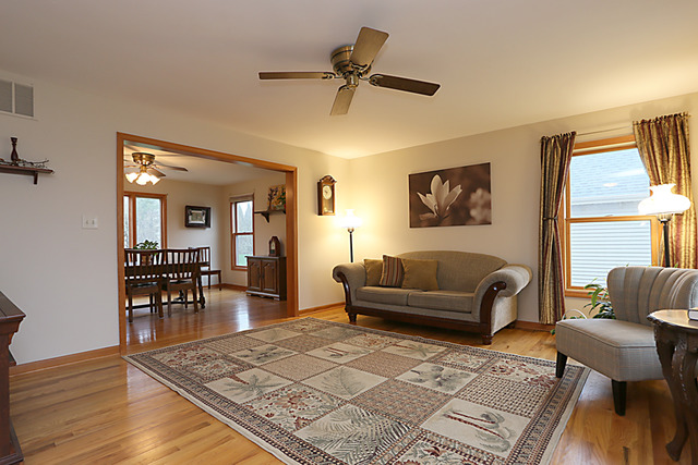654 Ridge Drive Elburn, IL 60119 - Photo 3 of 25 a living room with furniture and a dining table
