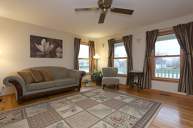 654 Ridge Drive Elburn, IL 60119 - Photo 4 of 25 a living room with furniture and a window