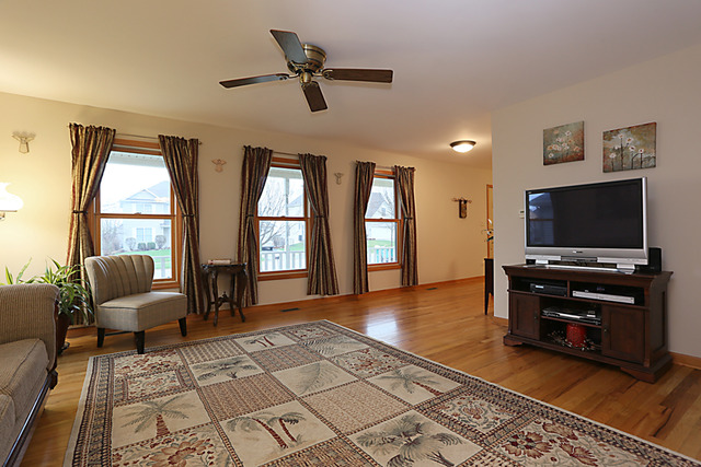 654 Ridge Drive Elburn, IL 60119 - Photo 5 of 25 a living room with furniture and a flat screen tv