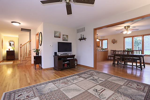 654 Ridge Drive Elburn, IL 60119 - Photo 6 of 25 a living room with furniture and a wooden floor
