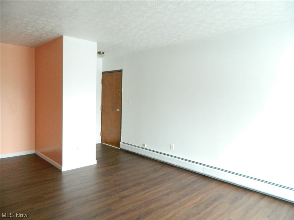 10744 Valley View Road, Unit B8 Northfield, OH 44067 - Photo 3 of 15 Living Room w/view to entryway/foyer and to the left, the dining area.