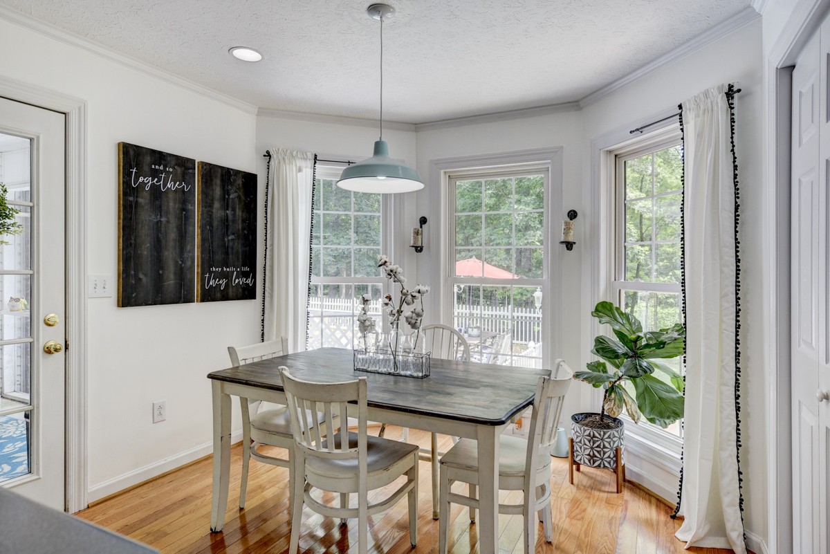 734 Keytown Road Portland, TN 37148 - Photo 16 of 49 a view of a dining room with furniture window and wooden floor