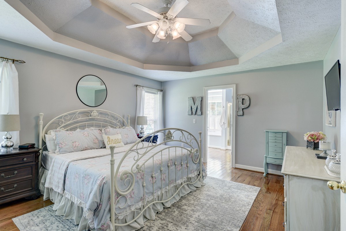 734 Keytown Road Portland, TN 37148 - Photo 18 of 49 a bedroom with a bed and a chandelier