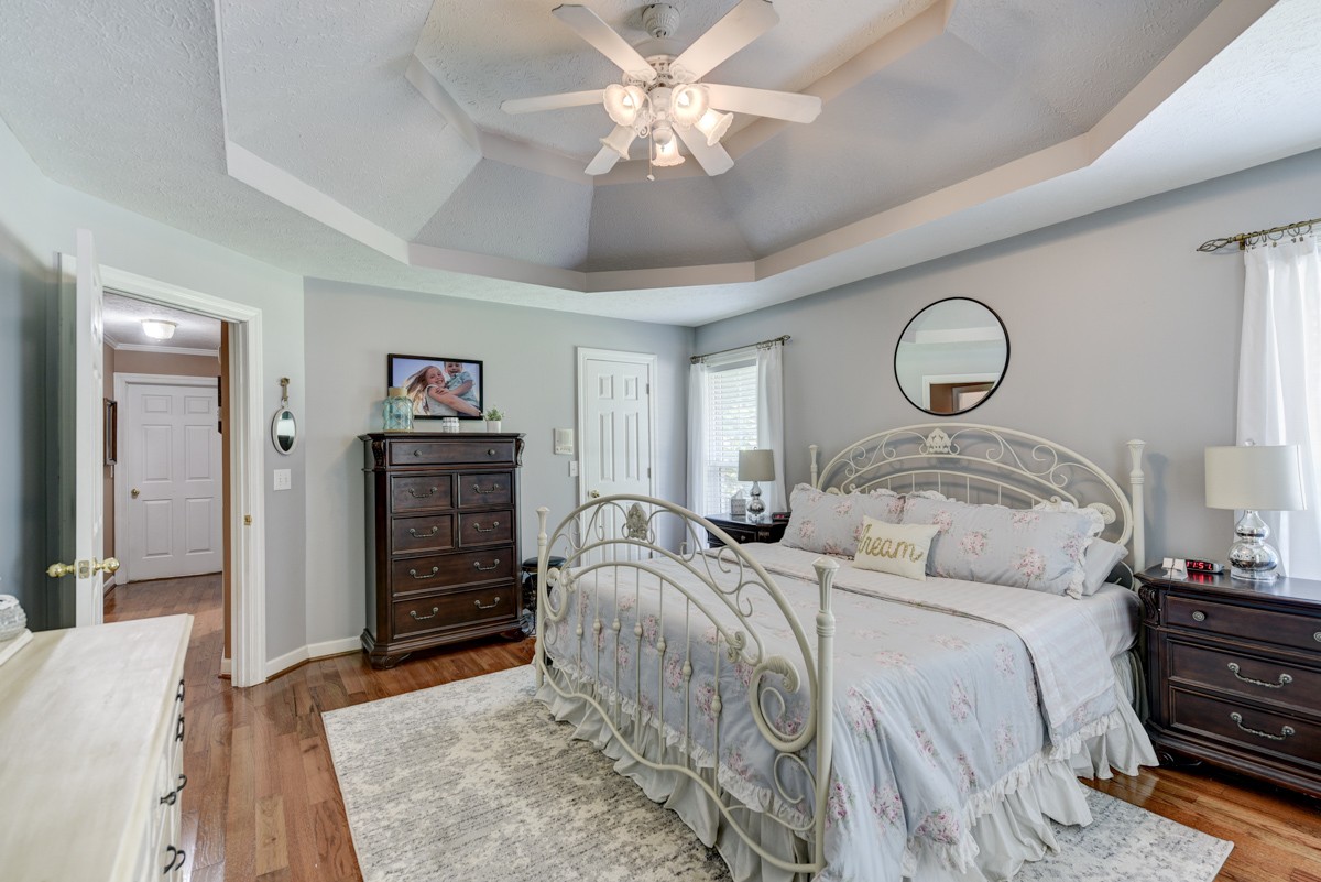 734 Keytown Road Portland, TN 37148 - Photo 19 of 49 a bedroom with bed and a chandelier