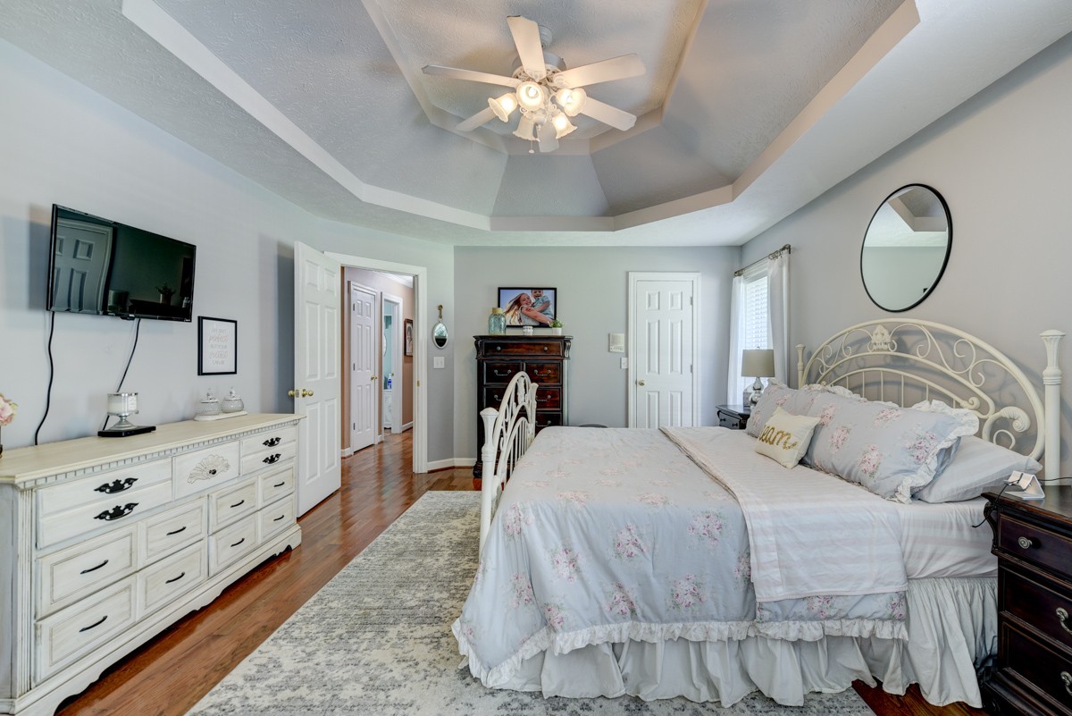 734 Keytown Road Portland, TN 37148 - Photo 20 of 49 a bedroom with a bed and a flat tv screen on dresser