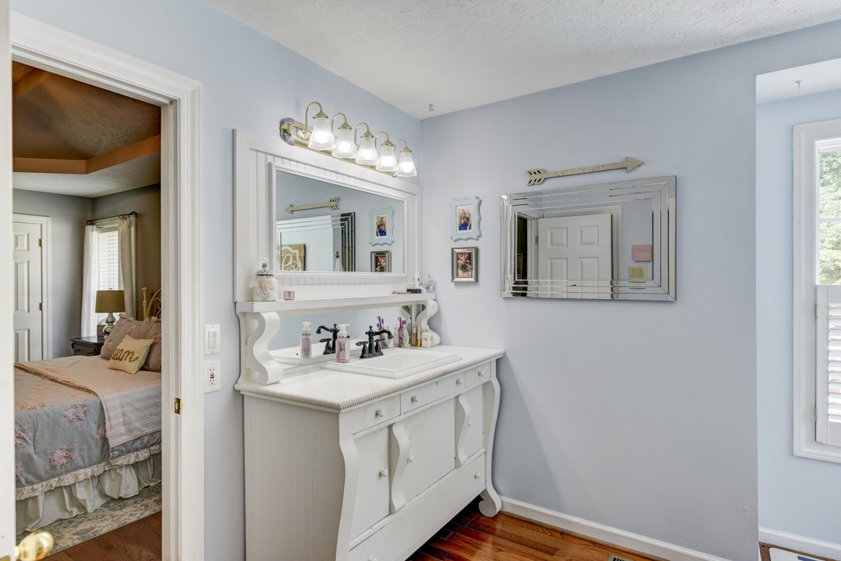 734 Keytown Road Portland, TN 37148 - Photo 23 of 49 a bathroom with a sink and a mirror