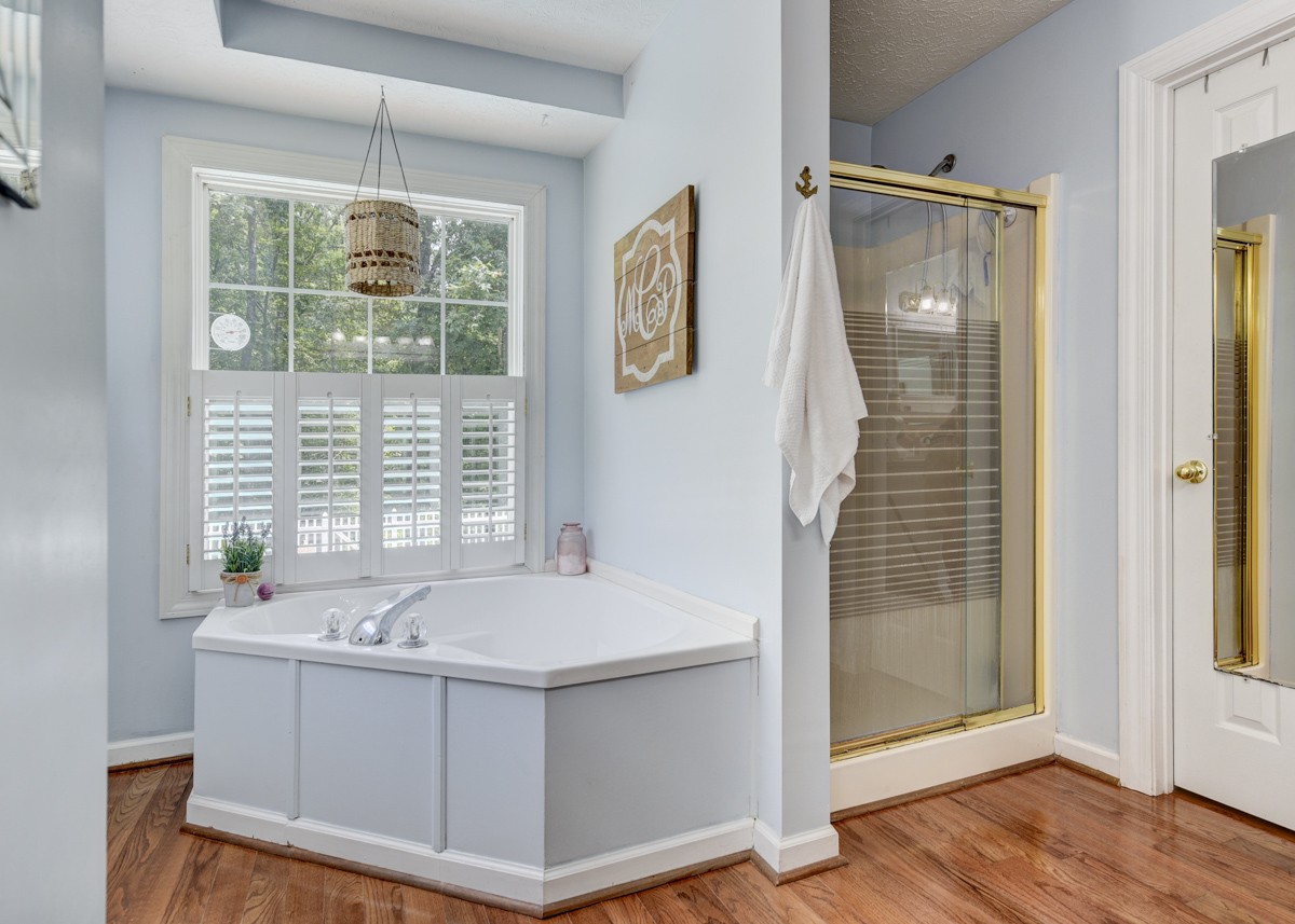 734 Keytown Road Portland, TN 37148 - Photo 24 of 49 a bathroom with a tub sink and glass door