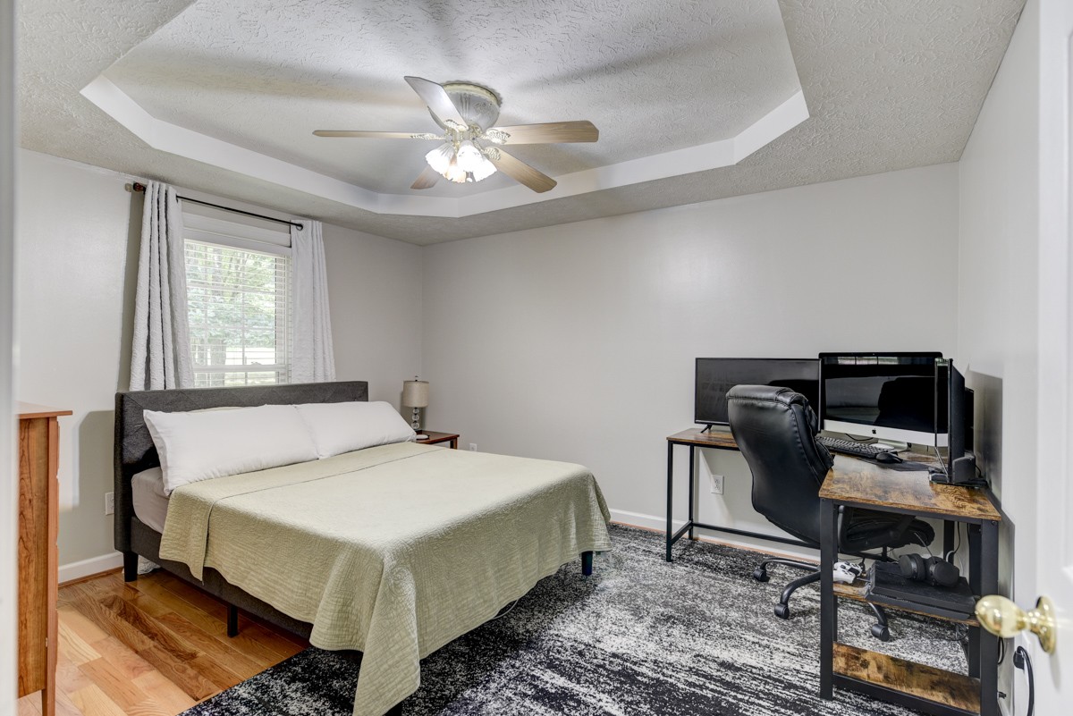 734 Keytown Road Portland, TN 37148 - Photo 25 of 49 a bed sitting in a room next to a window