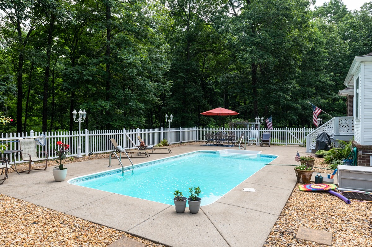 734 Keytown Road Portland, TN 37148 - Photo 29 of 49 a view of a swimming pool with chairs in patio