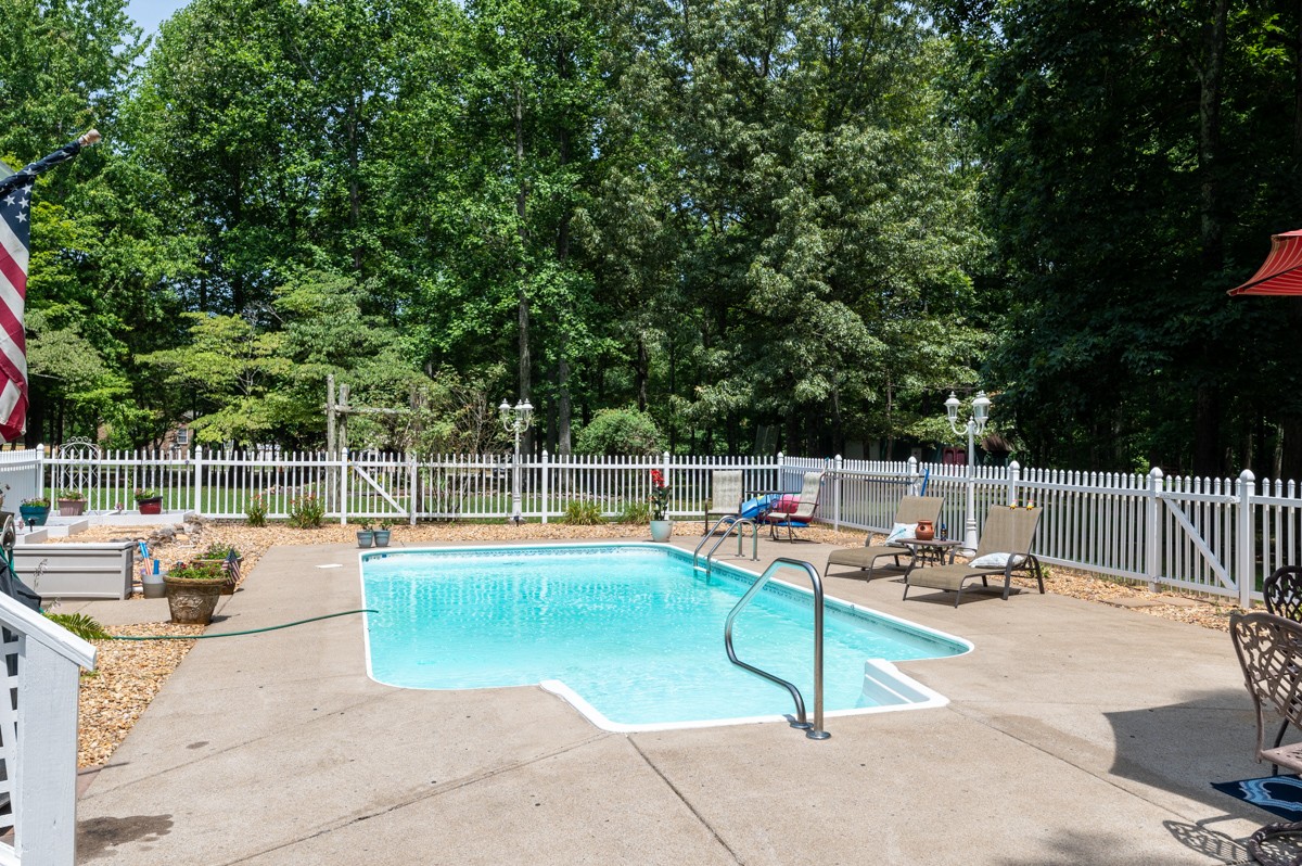 734 Keytown Road Portland, TN 37148 - Photo 30 of 49 a view of a swimming pool with a lounge chair