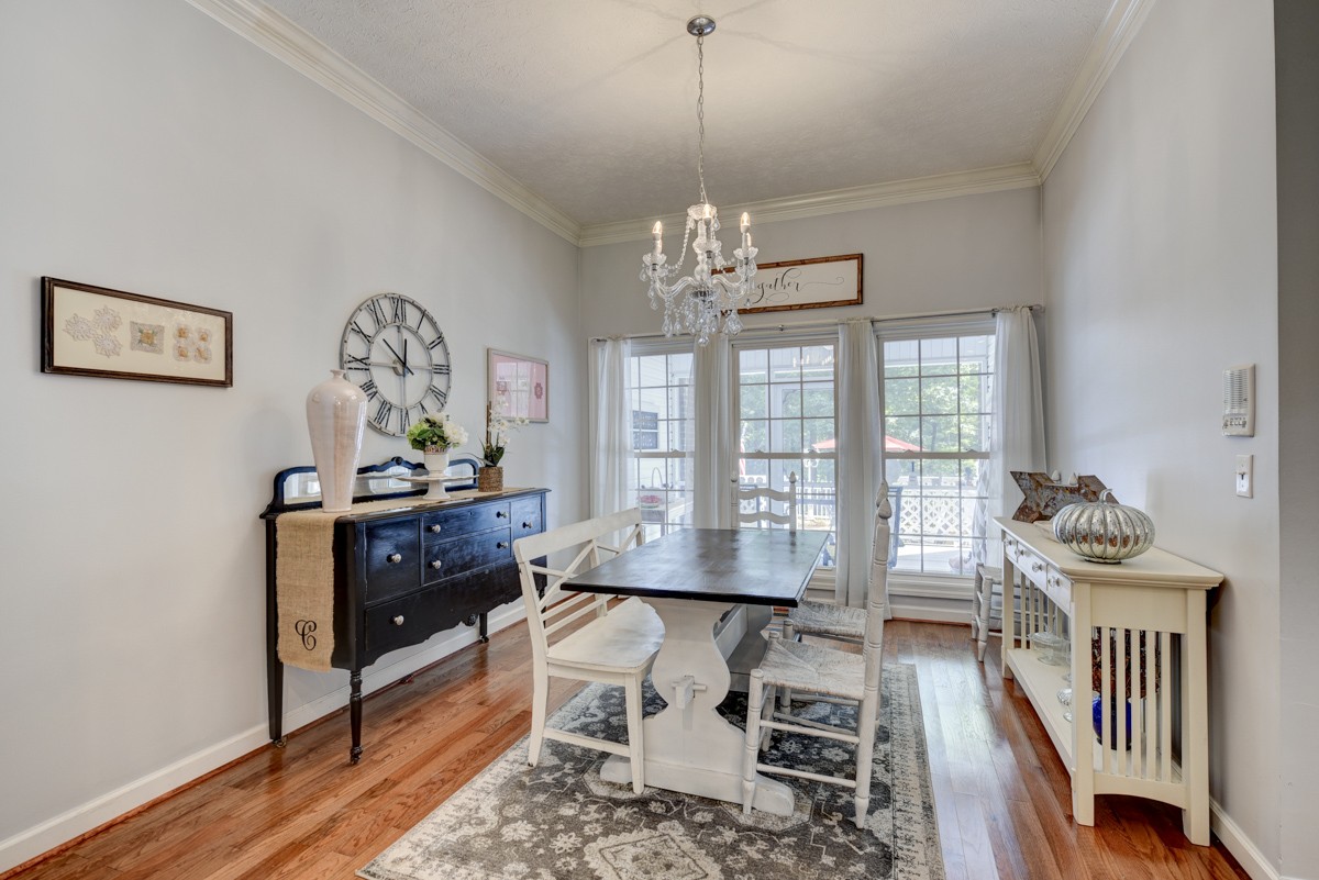734 Keytown Road Portland, TN 37148 - Photo 10 of 49 a view of a dining room with furniture a chandelier and wooden floor